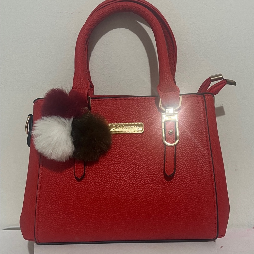 Elegant Red Handbag with Pom-Pom Charm